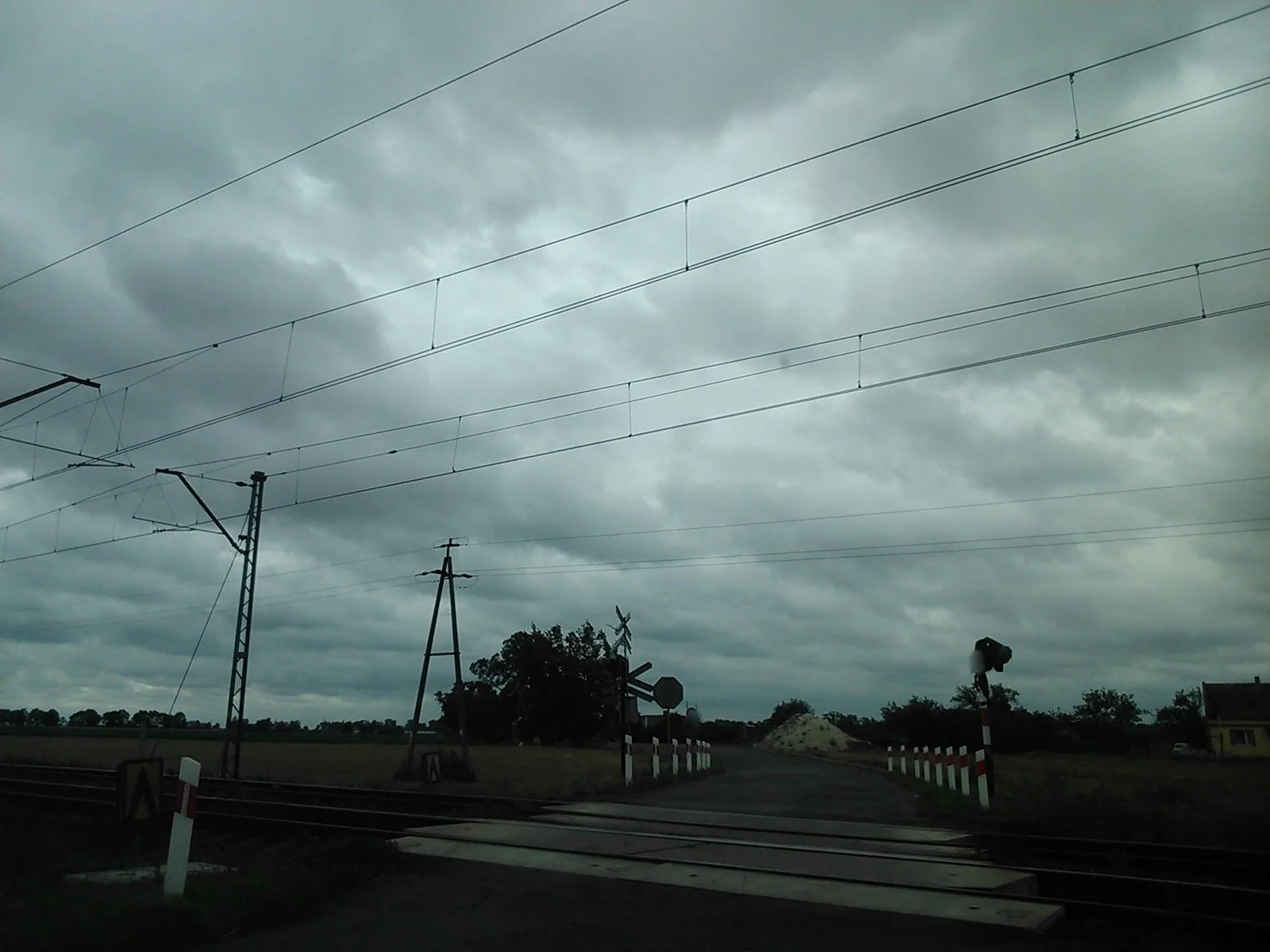 Street-level view of a level crossing in Poland