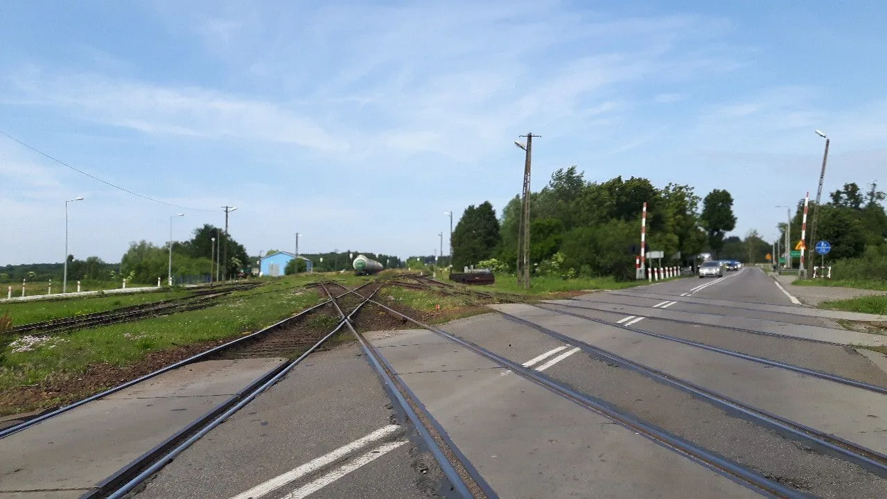 Street-level view of a level crossing in Poland