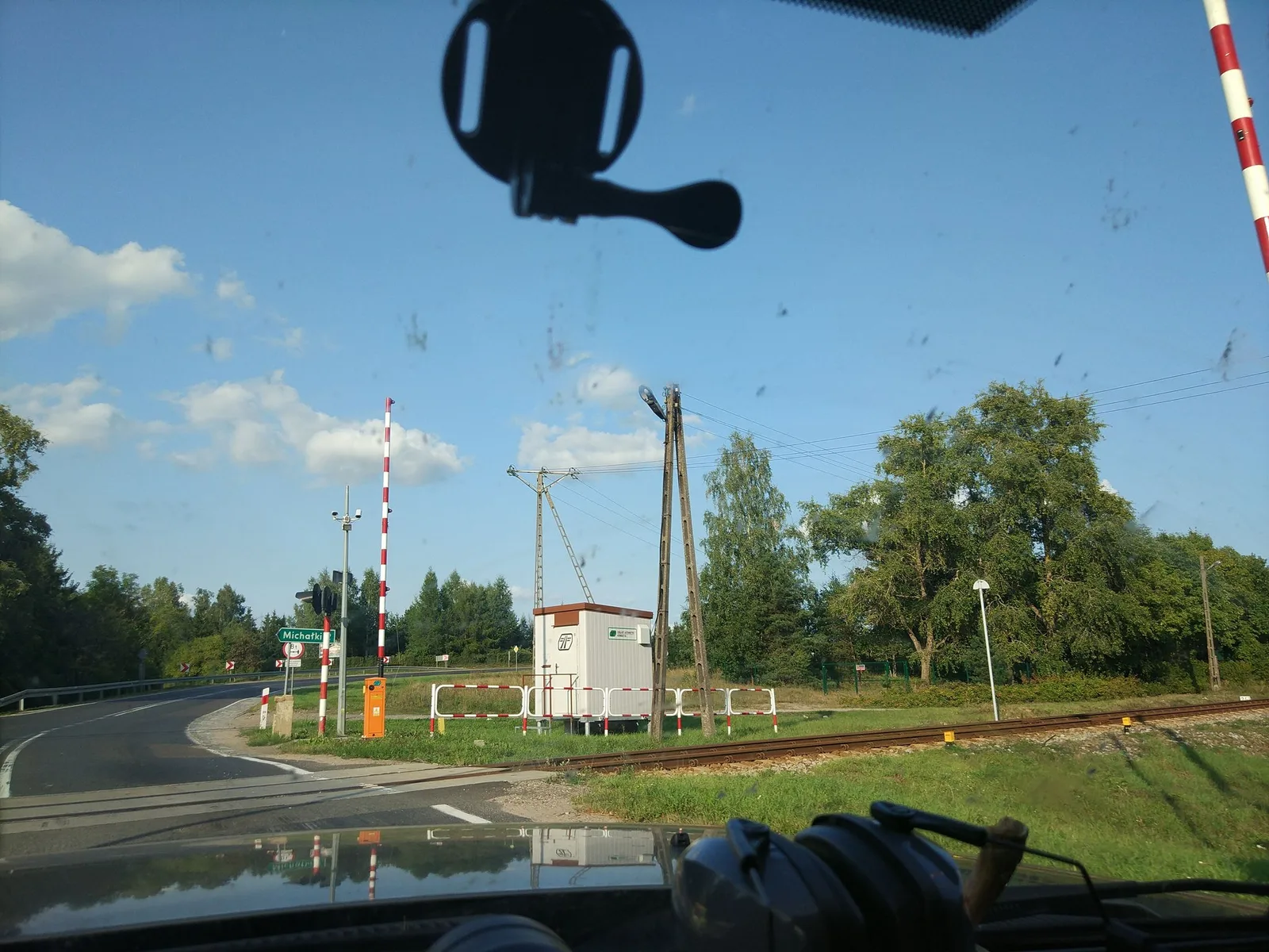 Street-level view of a level crossing in Poland