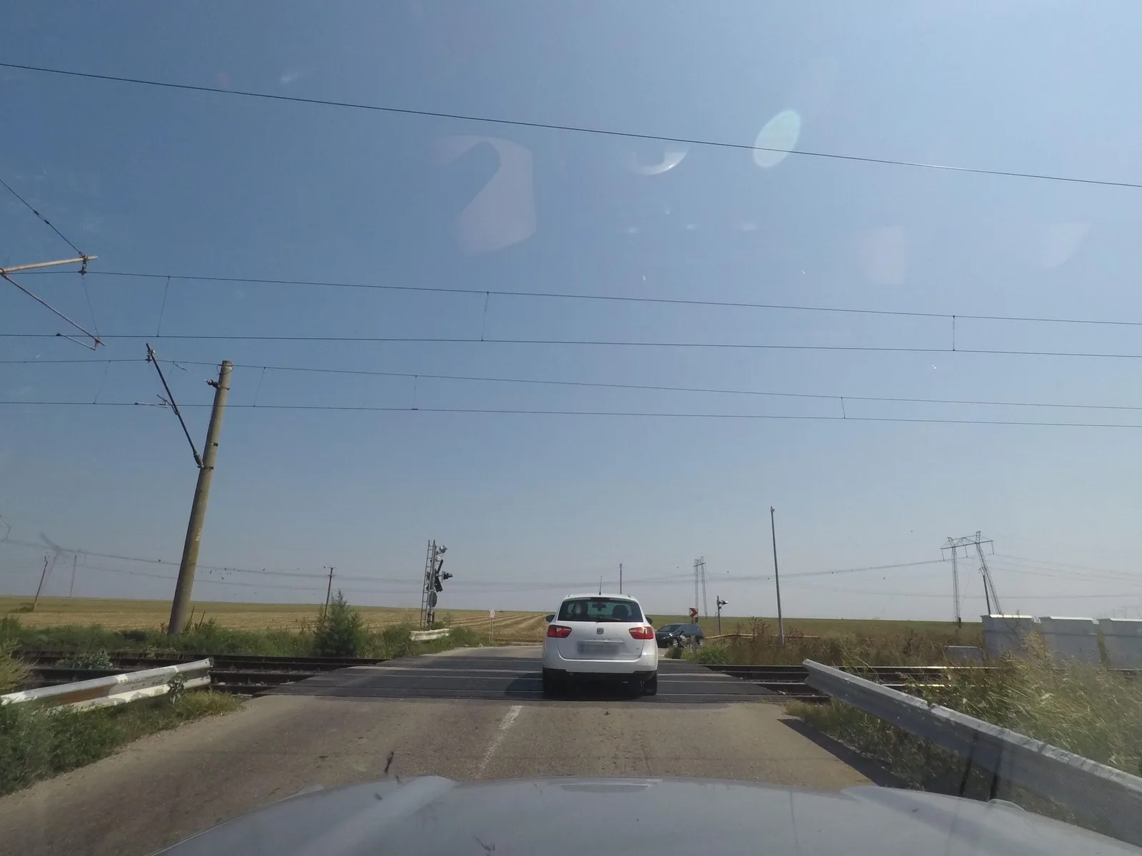 Street-level view of a level crossing in Romania