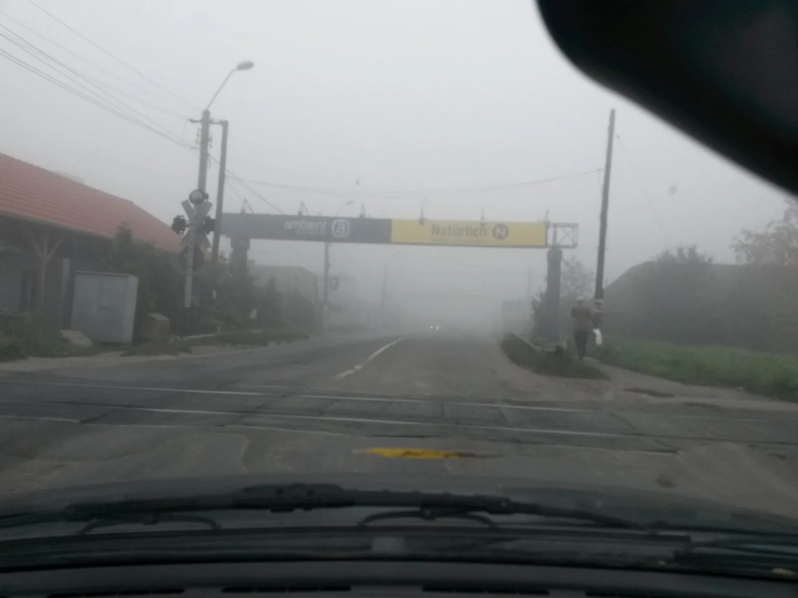 Street-level view of a level crossing in Romania