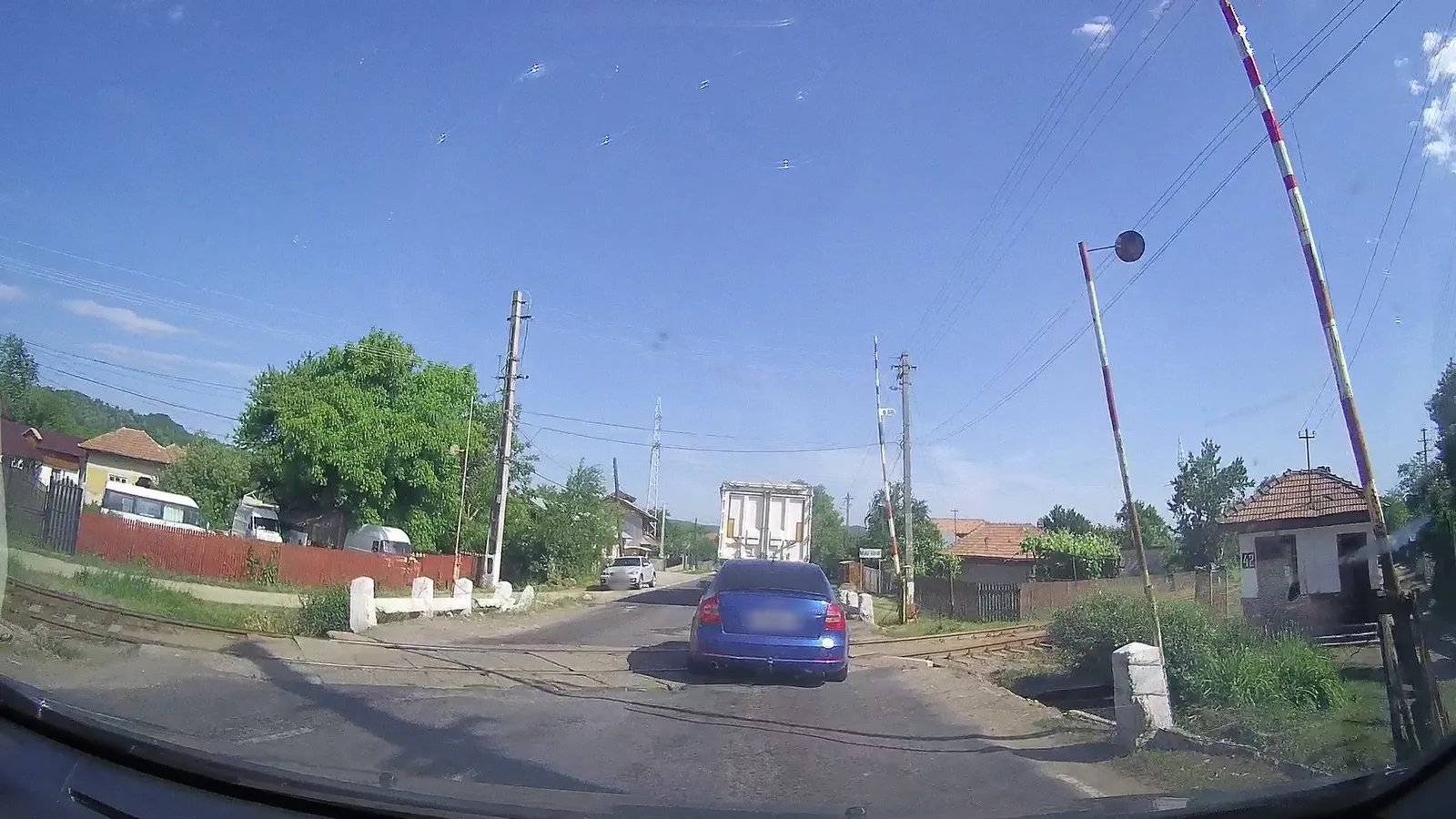 Street-level view of a level crossing in Romania