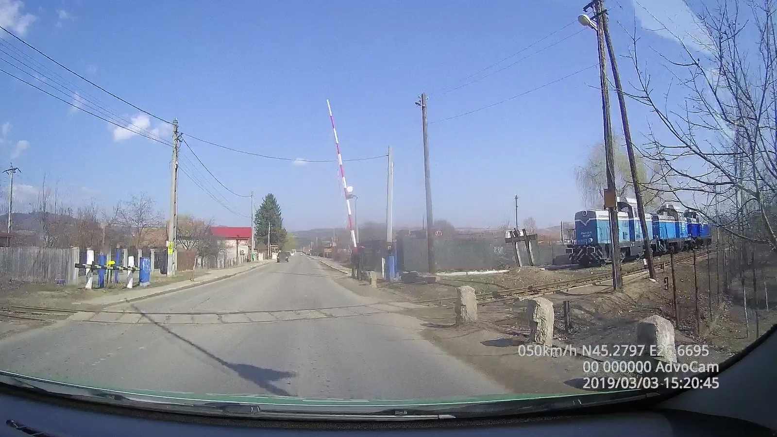 Street-level view of a level crossing in Romania