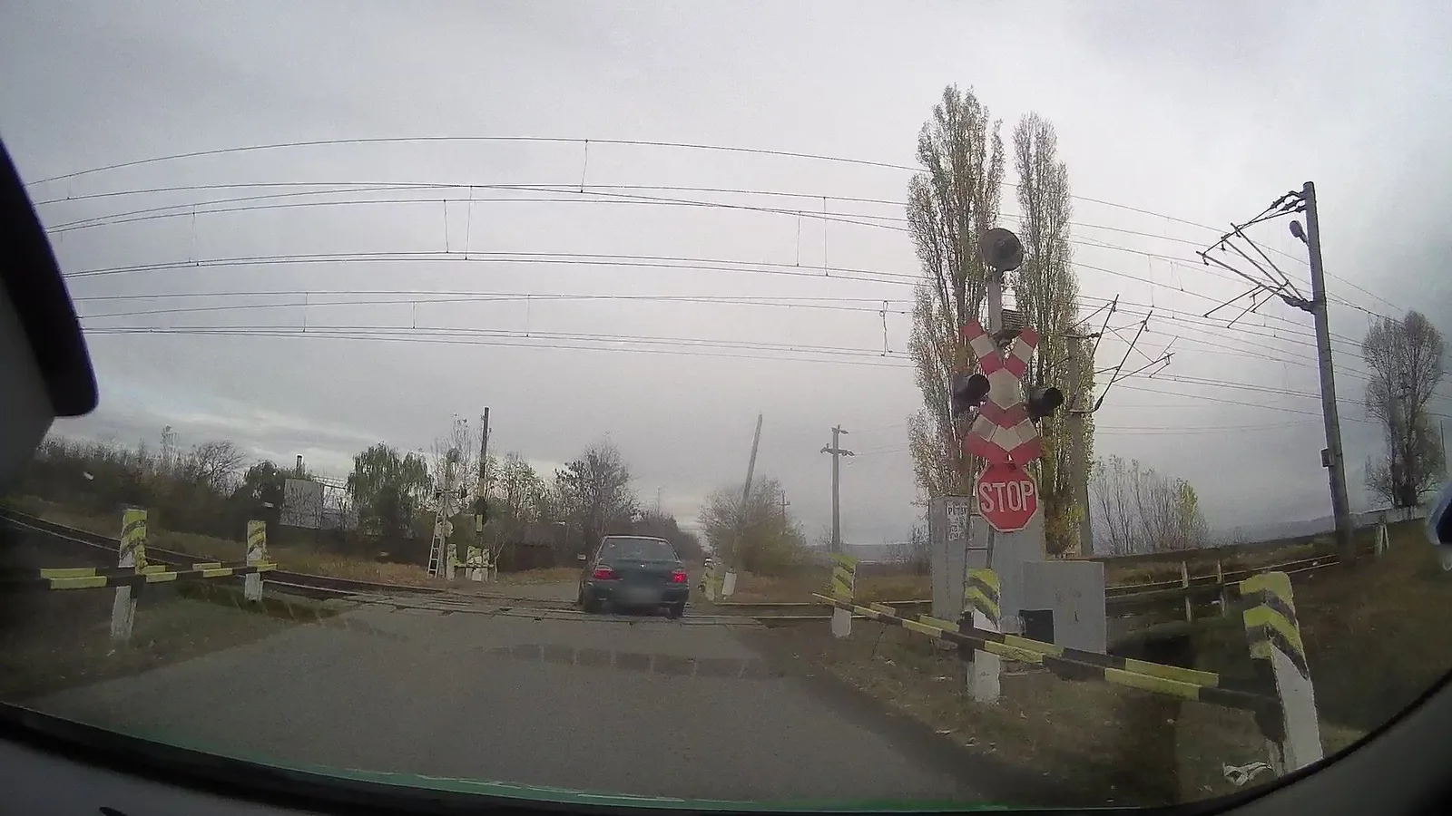 Street-level view of a level crossing in Romania