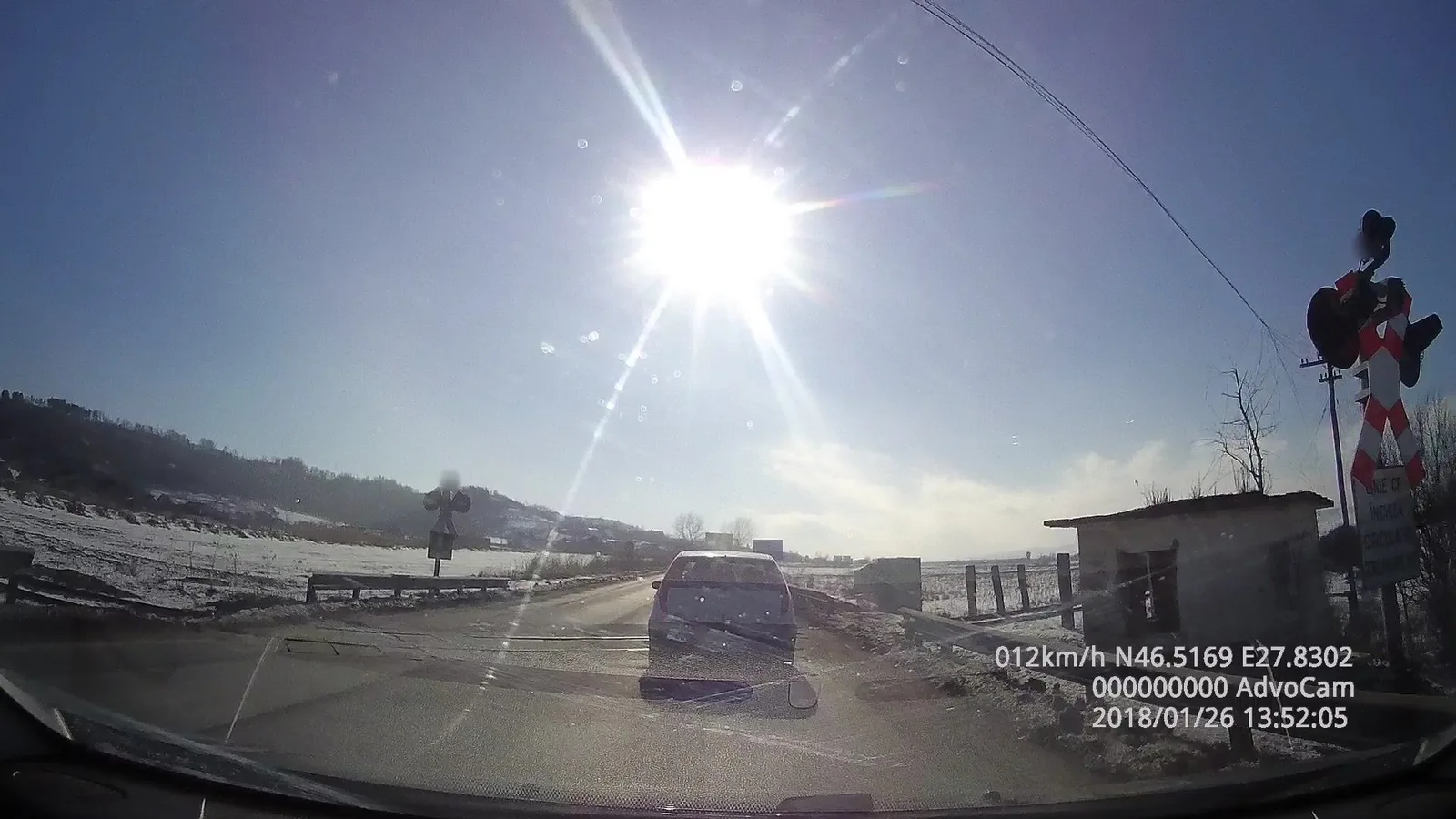 Street-level view of a level crossing in Romania