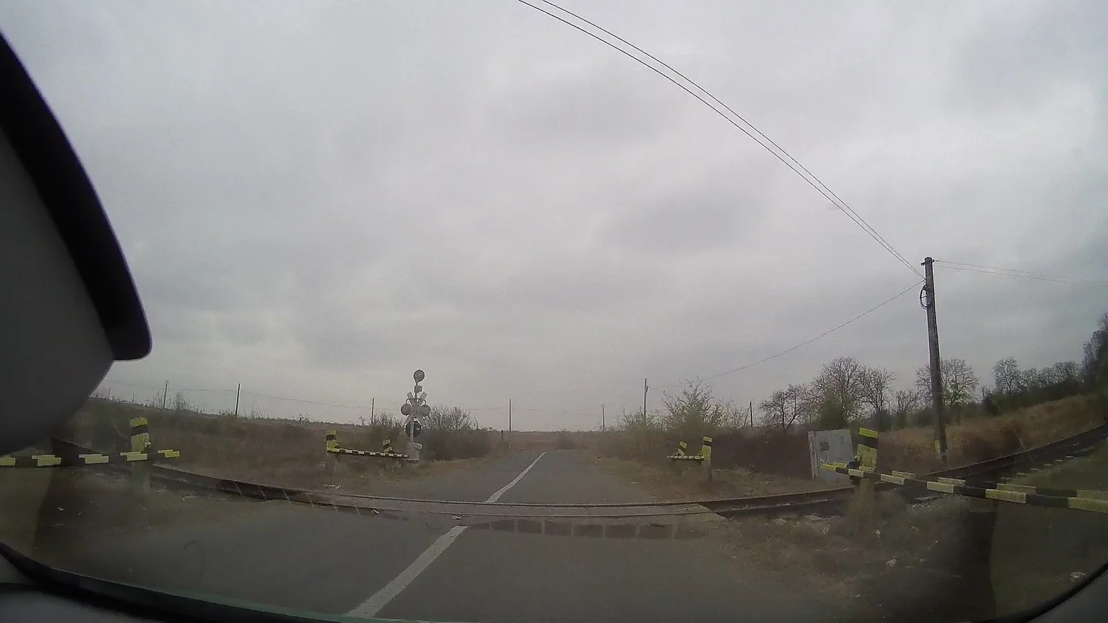 Street-level view of a level crossing in Romania