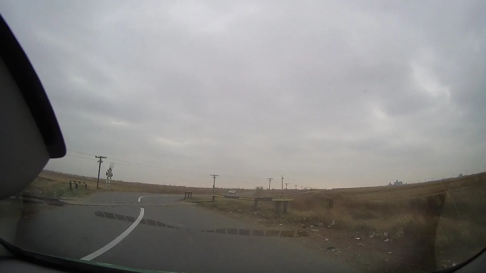 Street-level view of a level crossing in Romania