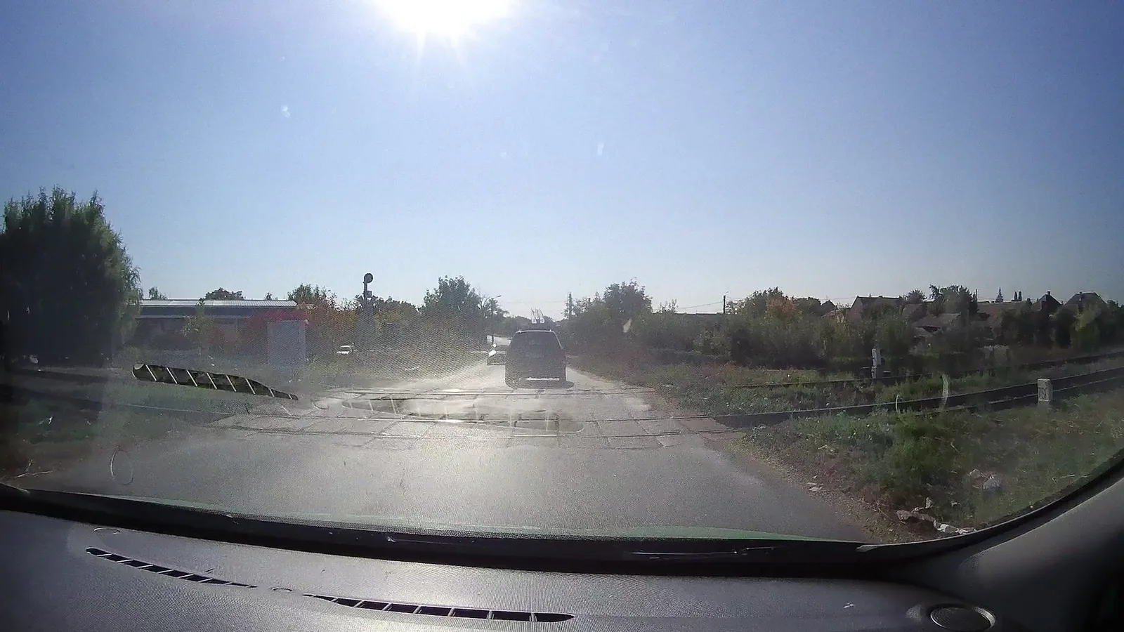 Street-level view of a level crossing in Romania