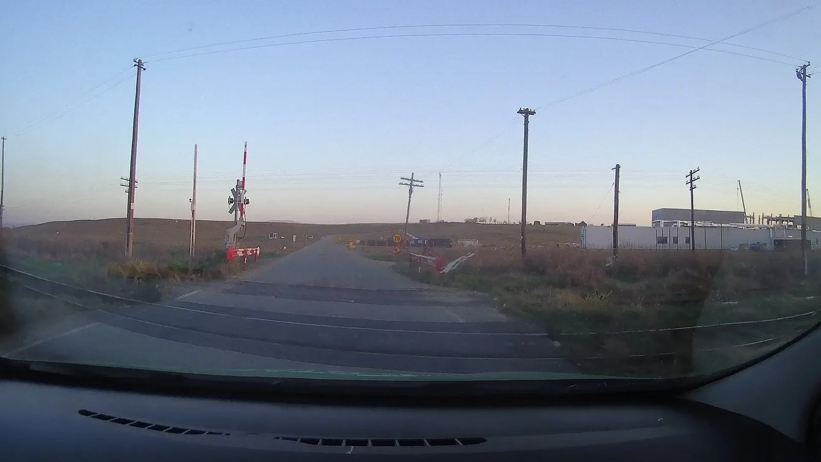 Street-level view of a level crossing in Romania