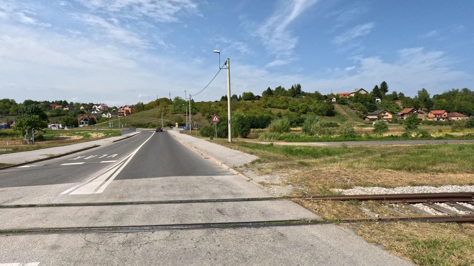 Street-level view of a level crossing in Slovenia