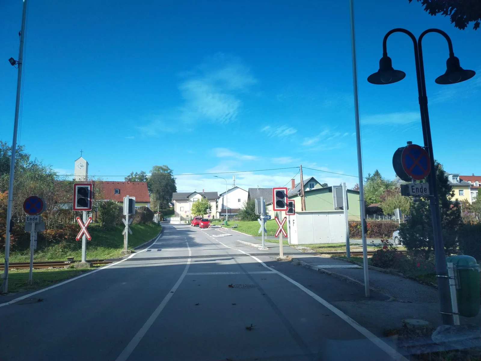 Street-level view of a level crossing in Slovenia