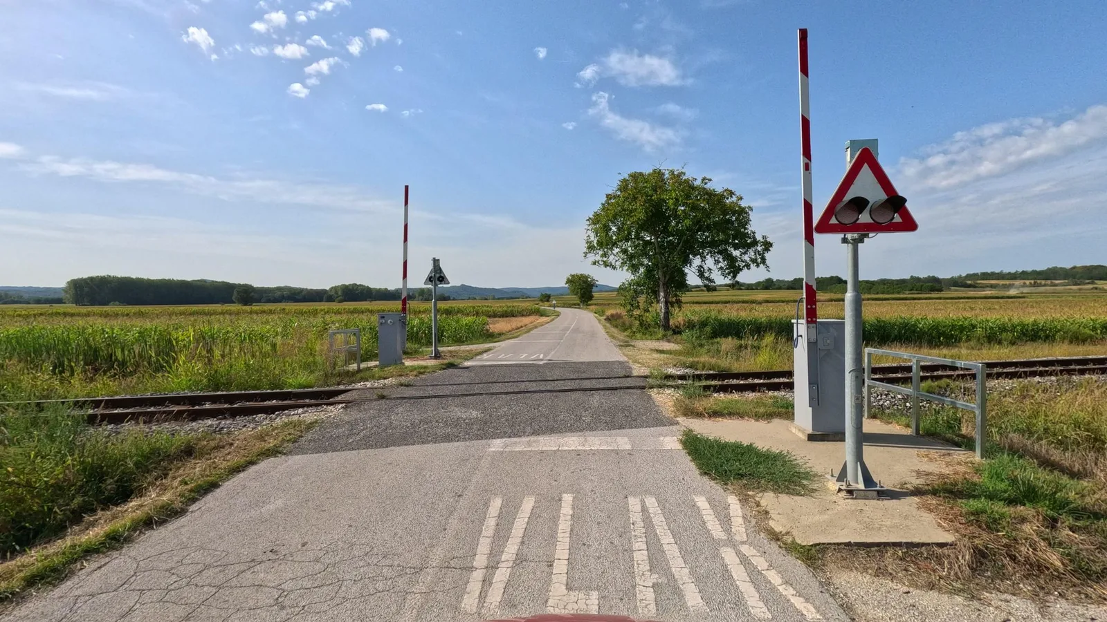 Street-level view of a level crossing in Slovenia