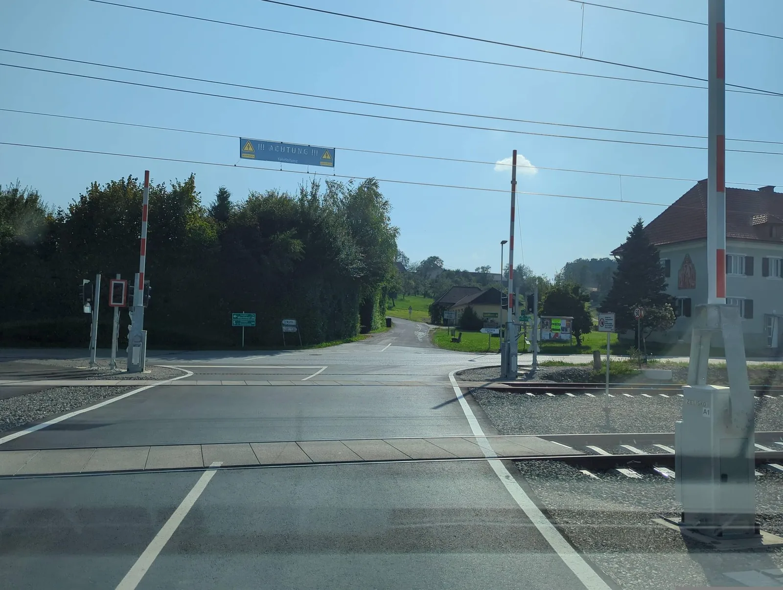 Street-level view of a level crossing in Slovenia