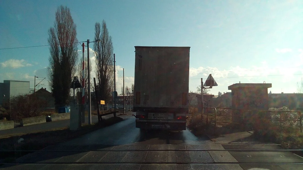 Street-level view of a level crossing in Slovenia