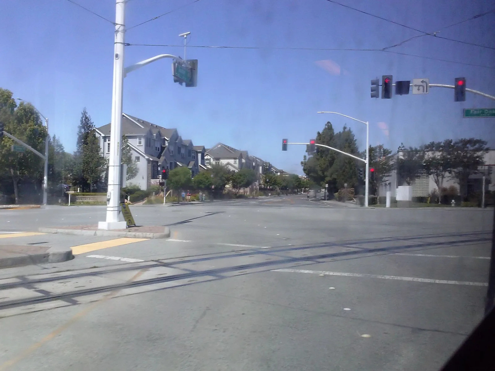 Street-level view of a highway-rail grade crossing in Fremont, California