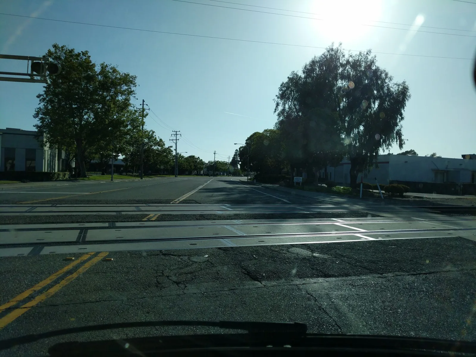 Street-level view of a highway-rail grade crossing in San Leandro, California