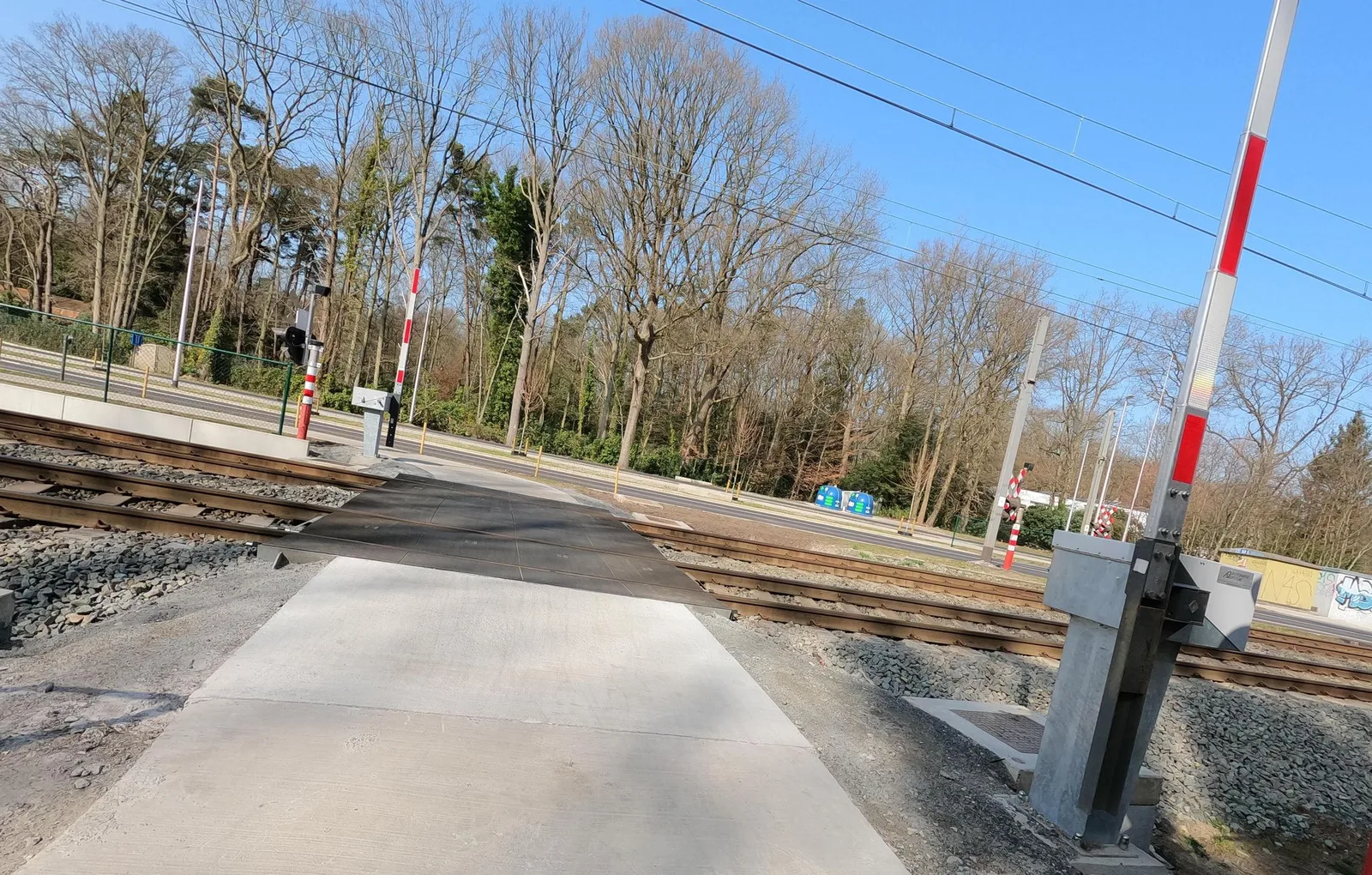 Street-level view of a level crossing in Belgium