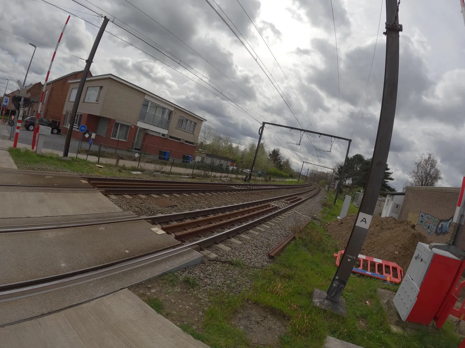 Street-level view of a level crossing in Belgium