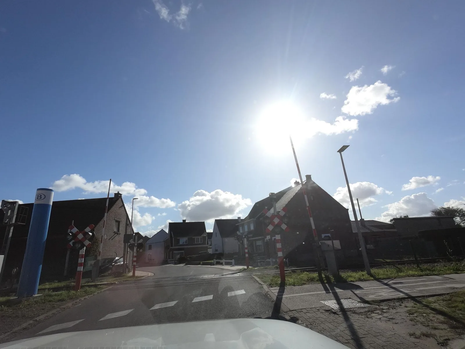 Street-level view of a level crossing in Belgium