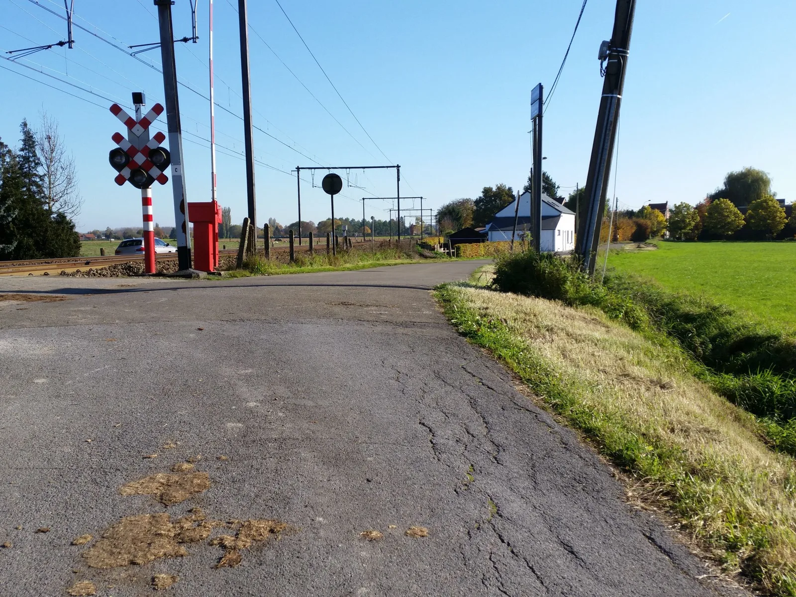 Street-level view of a level crossing in Belgium