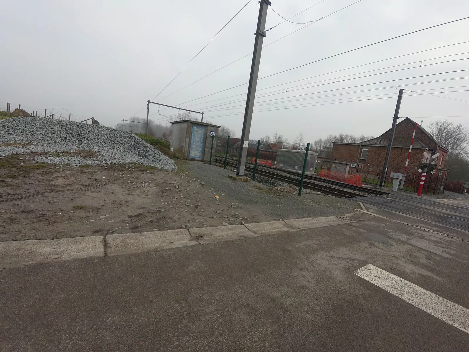 Street-level view of a level crossing in Belgium