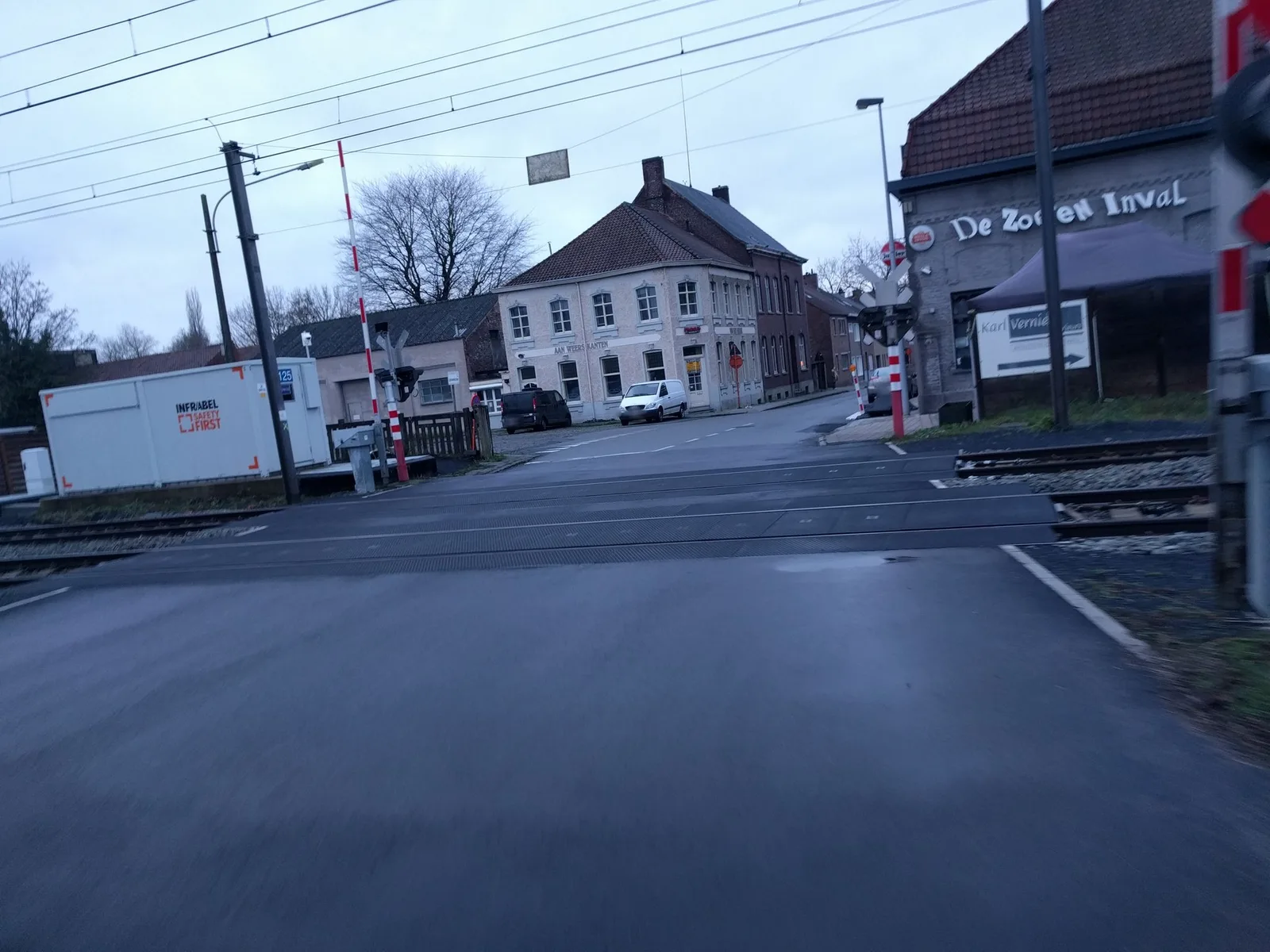 Street-level view of a level crossing in Belgium