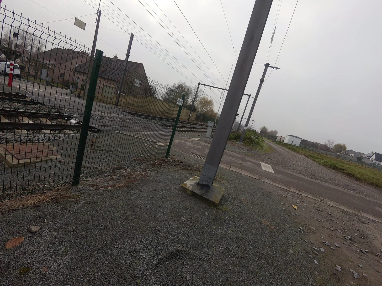 Street-level view of a level crossing in Belgium
