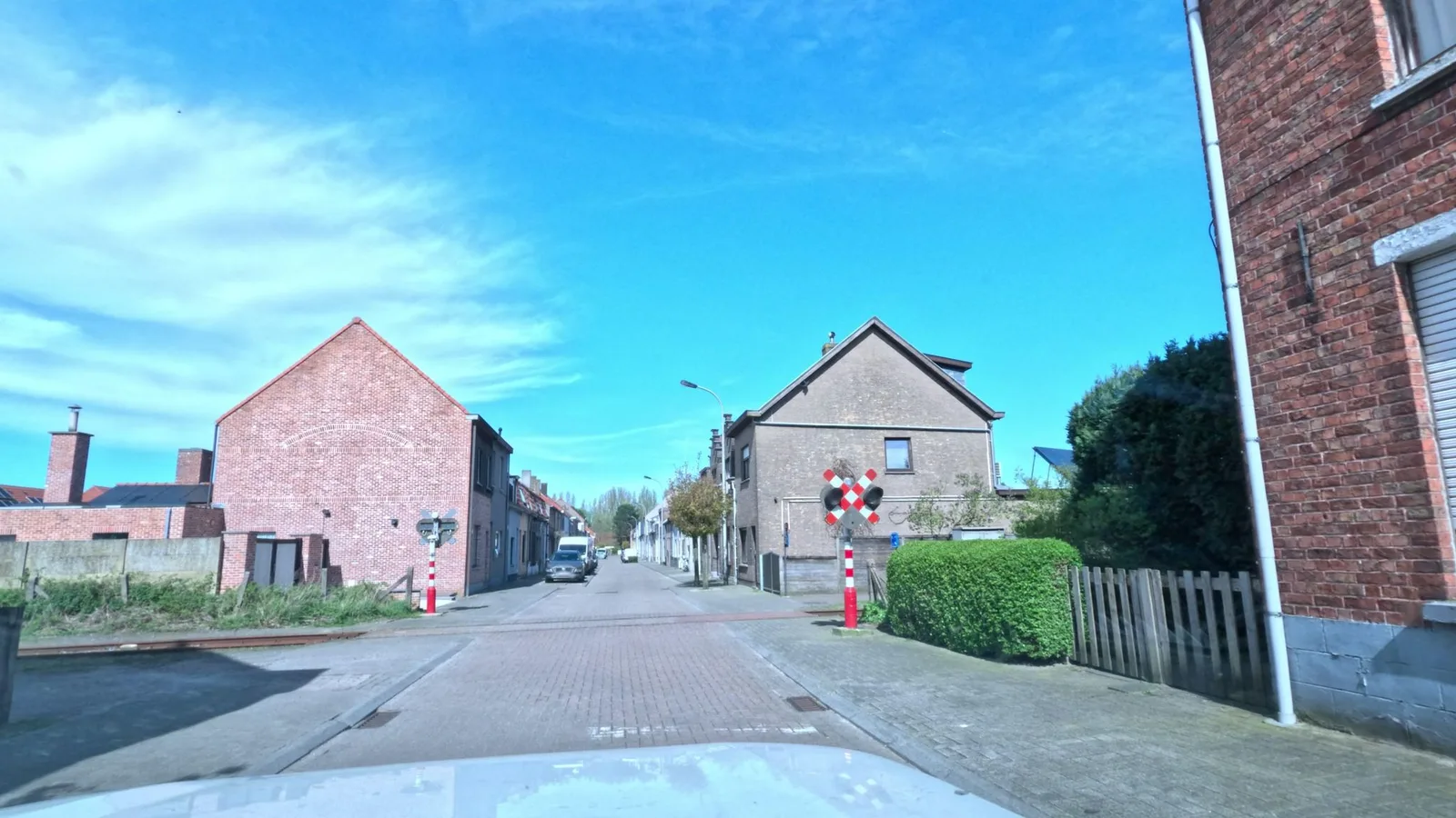 Street-level view of a level crossing in Belgium