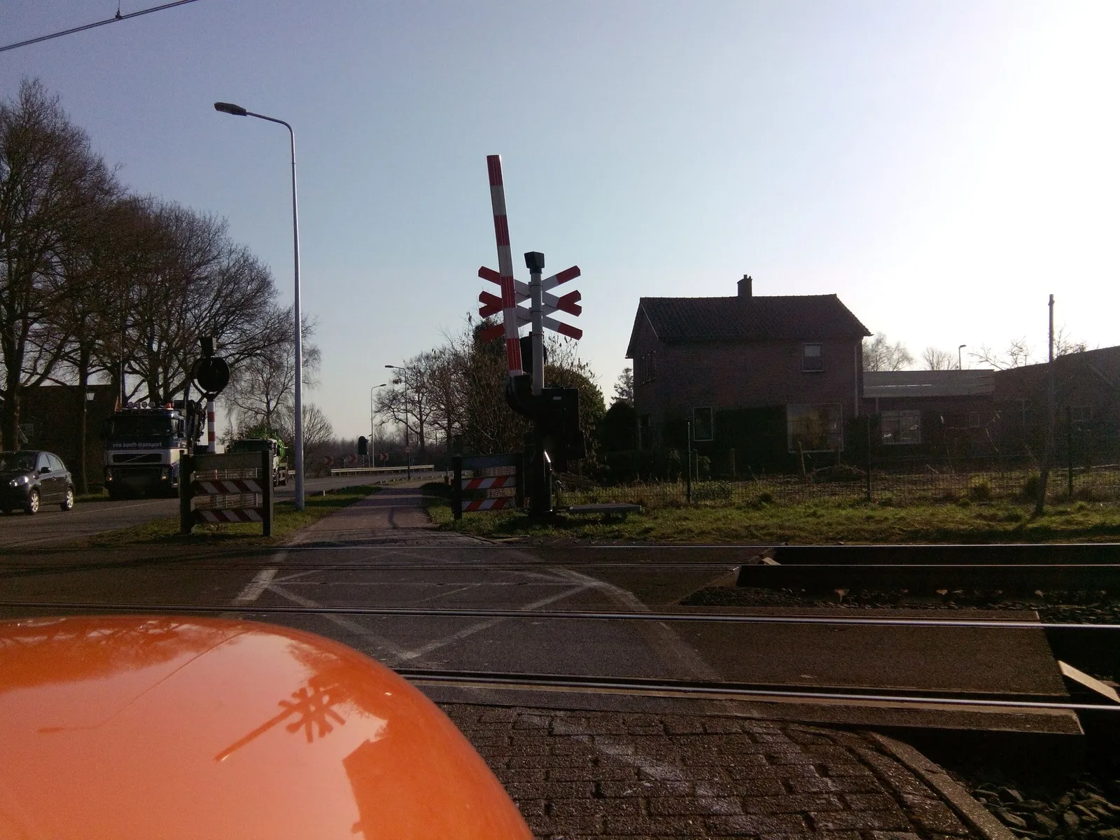 Street-level view of a level crossing in the Netherlands