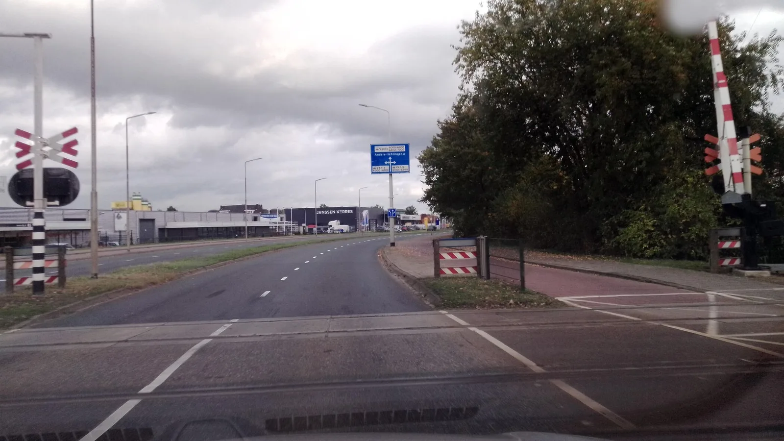 Street-level view of a level crossing in the Netherlands