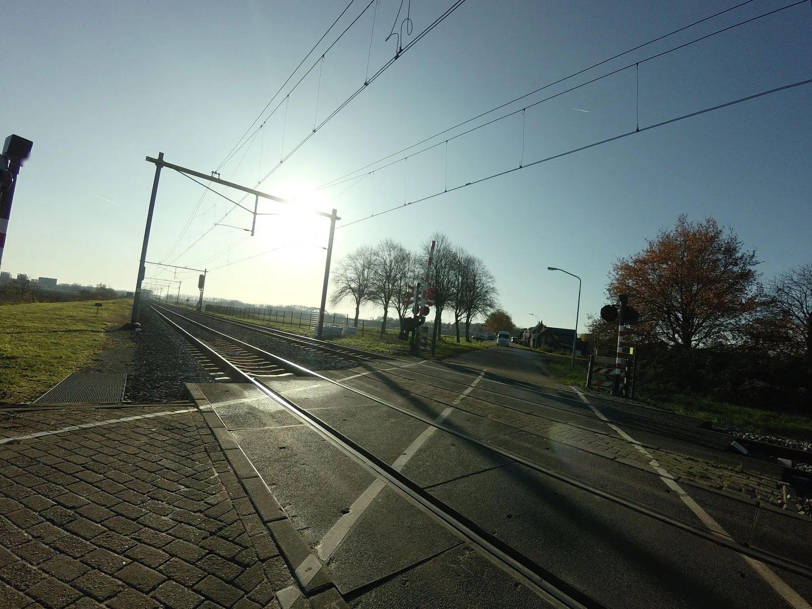 Street-level view of a level crossing in the Netherlands