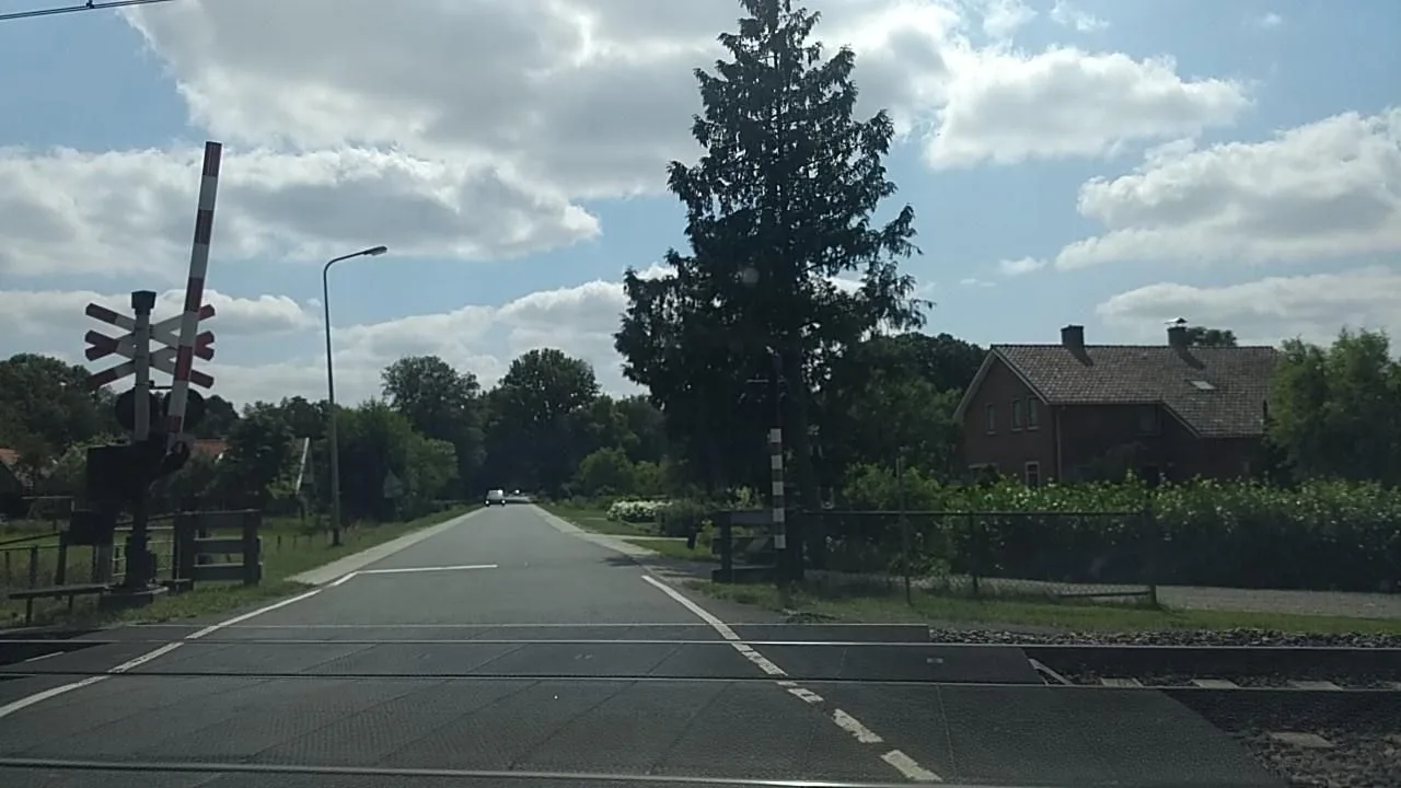 Street-level view of a level crossing in the Netherlands