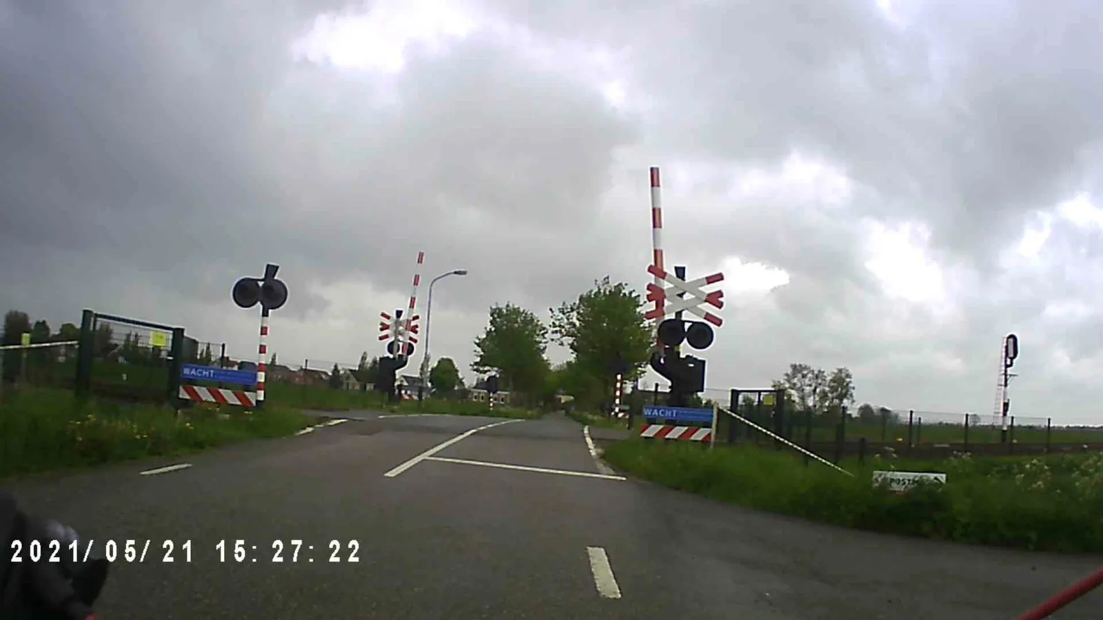 Street-level view of a level crossing in the Netherlands